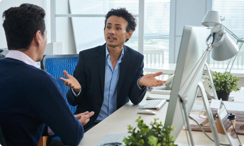 Webel Support team members discussing at the office